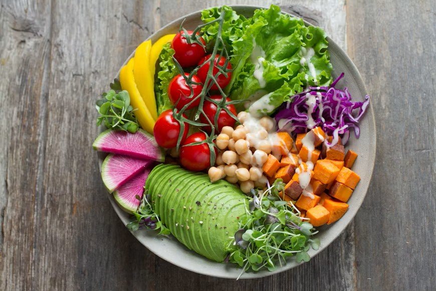 Healthy eating habits with avocado, chickpeas, tomatoes and fresh vegetables
